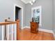 Upstairs hallway with hardwood floors, natural light, and stylish decor at 1403 W Watrous Ave, Tampa, FL 33606