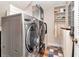 Efficient laundry room with modern washer and dryer and storage shelves at 1403 W Watrous Ave, Tampa, FL 33606