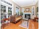 Comfortable living room featuring a fireplace, stylish furnishings, and large windows for natural light at 1403 W Watrous Ave, Tampa, FL 33606