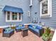 Cozy brick patio with comfortable seating and a stylish fire pit table at 1403 W Watrous Ave, Tampa, FL 33606