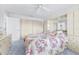Spacious bedroom featuring a comfortable bed, mirrored closet, and plenty of storage at 1706 Belleair Forest Dr # 336, Belleair, FL 33756