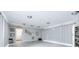 Large recreation room with seating and an exit at 1706 Belleair Forest Dr # 336, Belleair, FL 33756