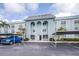 Beautiful exterior view of building with covered parking and well-maintained landscaping at 1706 Belleair Forest Dr # 336, Belleair, FL 33756