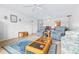 Inviting living room with wood floors, neutral walls, and lots of natural light at 1706 Belleair Forest Dr # 336, Belleair, FL 33756