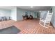Lobby seating area with wicker furniture and relaxing view of exterior at 1706 Belleair Forest Dr # 336, Belleair, FL 33756