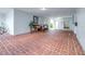 Community lobby area with brick floors, seating, and easy access to elevators at 1706 Belleair Forest Dr # 336, Belleair, FL 33756