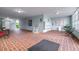 Community lobby area with brick floors, mailboxes, seating, and access to elevators at 1706 Belleair Forest Dr # 336, Belleair, FL 33756