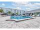 Exterior view of a community pool with a paver deck, perfect for relaxation and recreation at 1706 Belleair Forest Dr # 336, Belleair, FL 33756