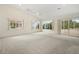 Expansive bedroom with vaulted ceilings, plush carpet, and multiple windows for natural light at 1805 Granville Ln, Sun City Center, FL 33573