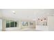 Bright living space with large windows, neutral colors, and open access to the kitchen at 1805 Granville Ln, Sun City Center, FL 33573