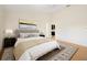 A spacious main bedroom featuring a ceiling fan, a comfortable bed and a walk-in closet at 1805 Granville Ln, Sun City Center, FL 33573
