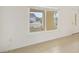 Bright room featuring tile flooring, a window with blinds, and a view of the street at 1805 Granville Ln, Sun City Center, FL 33573