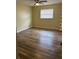 Bedroom with ceiling fan, new floors and natural light at 1809 Driftwood N Cir, Oldsmar, FL 34677