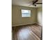Bedroom featuring new floors, neutral paint, and a ceiling fan at 1809 Driftwood N Cir, Oldsmar, FL 34677