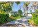 Charming single-story home with an attached two-car garage and mature landscaping at 18132 Oakdale Rd, Odessa, FL 33556