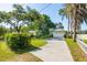 Charming single-story home with a two-car garage, long driveway, and lush green lawn at 18132 Oakdale Rd, Odessa, FL 33556