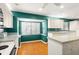 Open kitchen featuring ample cabinet space, modern appliances, and a cozy breakfast nook at 18132 Oakdale Rd, Odessa, FL 33556
