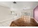 Open-concept living room with hardwood flooring and views of the outdoor lake area at 18132 Oakdale Rd, Odessa, FL 33556