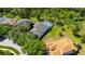 Aerial view of a beautiful home, showcasing a screened in pool and lush surroundings at 21744 Waverly Shores Ln, Land O Lakes, FL 34637