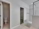 Bright bathroom featuring a toilet, walk-in closet, and glass-enclosed shower at 21744 Waverly Shores Ln, Land O Lakes, FL 34637