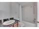 Clean bathroom with a vanity and shower-tub combination with a white shower curtain at 21744 Waverly Shores Ln, Land O Lakes, FL 34637