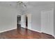Spacious bedroom featuring wood floors, neutral walls, and multiple closets for ample storage at 21744 Waverly Shores Ln, Land O Lakes, FL 34637