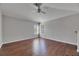 Bedroom with hardwood floors, ceiling fan, and large windows with blinds at 21744 Waverly Shores Ln, Land O Lakes, FL 34637