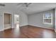 Bright bedroom featuring hardwood floors, a ceiling fan, and a full bathroom at 21744 Waverly Shores Ln, Land O Lakes, FL 34637