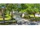 Charming single-Gathering home featuring lush landscaping, a two car garage, and inviting curb appeal at 21744 Waverly Shores Ln, Land O Lakes, FL 34637