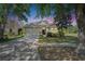 Charming home with a well-manicured lawn, mature trees, and a welcoming facade at 21744 Waverly Shores Ln, Land O Lakes, FL 34637