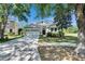 Charming single-Gathering home with a two-car garage, well-maintained lawn, and beautiful landscaping at 21744 Waverly Shores Ln, Land O Lakes, FL 34637