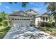 Charming single-Gathering home featuring a two-car garage and beautiful stone accents at 21744 Waverly Shores Ln, Land O Lakes, FL 34637
