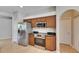 The kitchen includes stainless steel appliances, solid surface counters and ample cabinet space at 21744 Waverly Shores Ln, Land O Lakes, FL 34637