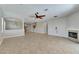 Large living room with open layout, fireplace, and tile flooring at 21744 Waverly Shores Ln, Land O Lakes, FL 34637