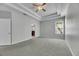 Main bedroom features tray ceiling and carpet at 21744 Waverly Shores Ln, Land O Lakes, FL 34637