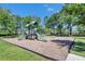 A community playground has swings, slides, and climbing apparatus for the community to enjoy outdoors at 21744 Waverly Shores Ln, Land O Lakes, FL 34637