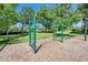 A jungle gym is available at the neighborhood playground on top of the wood chips at 21744 Waverly Shores Ln, Land O Lakes, FL 34637