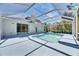 Backyard pool area, featuring a screened enclosure and a serene outdoor oasis at 21744 Waverly Shores Ln, Land O Lakes, FL 34637