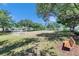 A community soccer field has two goals with trees on a green grass field under a blue sky at 21744 Waverly Shores Ln, Land O Lakes, FL 34637