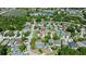 An aerial view showcases the neighborhood's lush greenery, picturesque lakes, and ideal location at 26850 Middleground Loop, Wesley Chapel, FL 33544