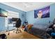 Comfortable bedroom with ample natural light and a dedicated workspace at 26850 Middleground Loop, Wesley Chapel, FL 33544