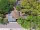 Home aerial view revealing the roof, lush greenery, and proximity to the street at 3411 N 12Th St, Tampa, FL 33605