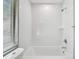 Clean, bright bathroom with white subway tile, a shower-tub combo, and sleek fixtures at 3411 N 12Th St, Tampa, FL 33605