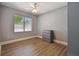Cozy bedroom with warm wood floors, and a window offering natural light at 3411 N 12Th St, Tampa, FL 33605
