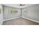 A bedroom with gray walls, white trim, and hard surface flooring at 3411 N 12Th St, Tampa, FL 33605
