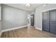 Spacious bedroom with hardwood floors, grey walls, ceiling fan and closet at 3411 N 12Th St, Tampa, FL 33605