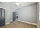 Well-lit bedroom featuring neutral walls, gray doors and a ceiling fan at 3411 N 12Th St, Tampa, FL 33605