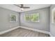 Bright bedroom with neutral walls, modern trim, and windows offering natural light at 3411 N 12Th St, Tampa, FL 33605