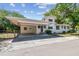 A house with a carport and mature landscaping at 3411 N 12Th St, Tampa, FL 33605