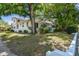 A charming two-story home with mature trees and landscaping at 3411 N 12Th St, Tampa, FL 33605